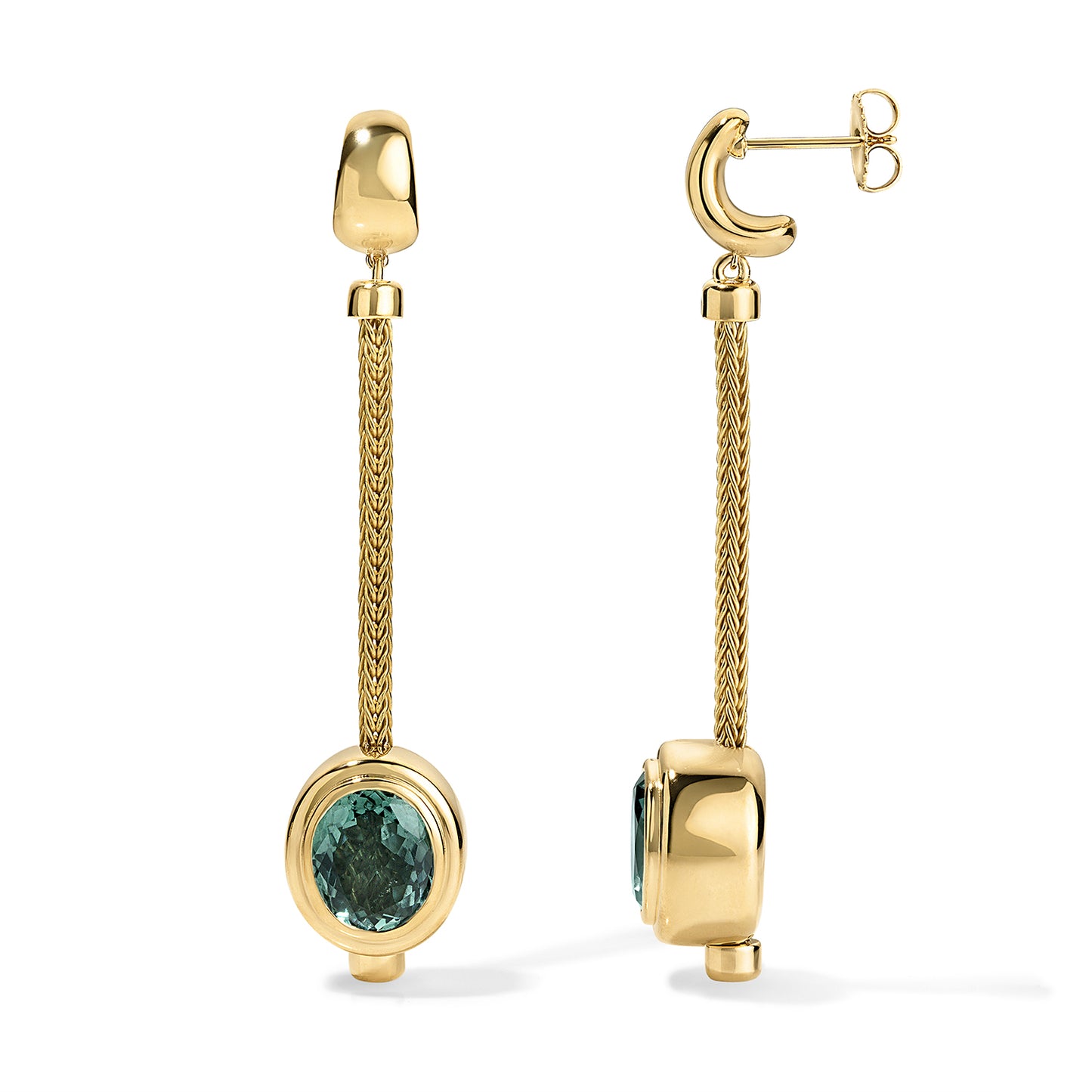 Gold earrings with green gemstones on a white background