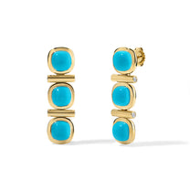 Gold earrings with turquoise stones on a white background