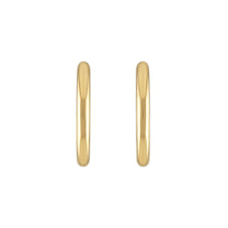 Gold hoop earrings on a white background