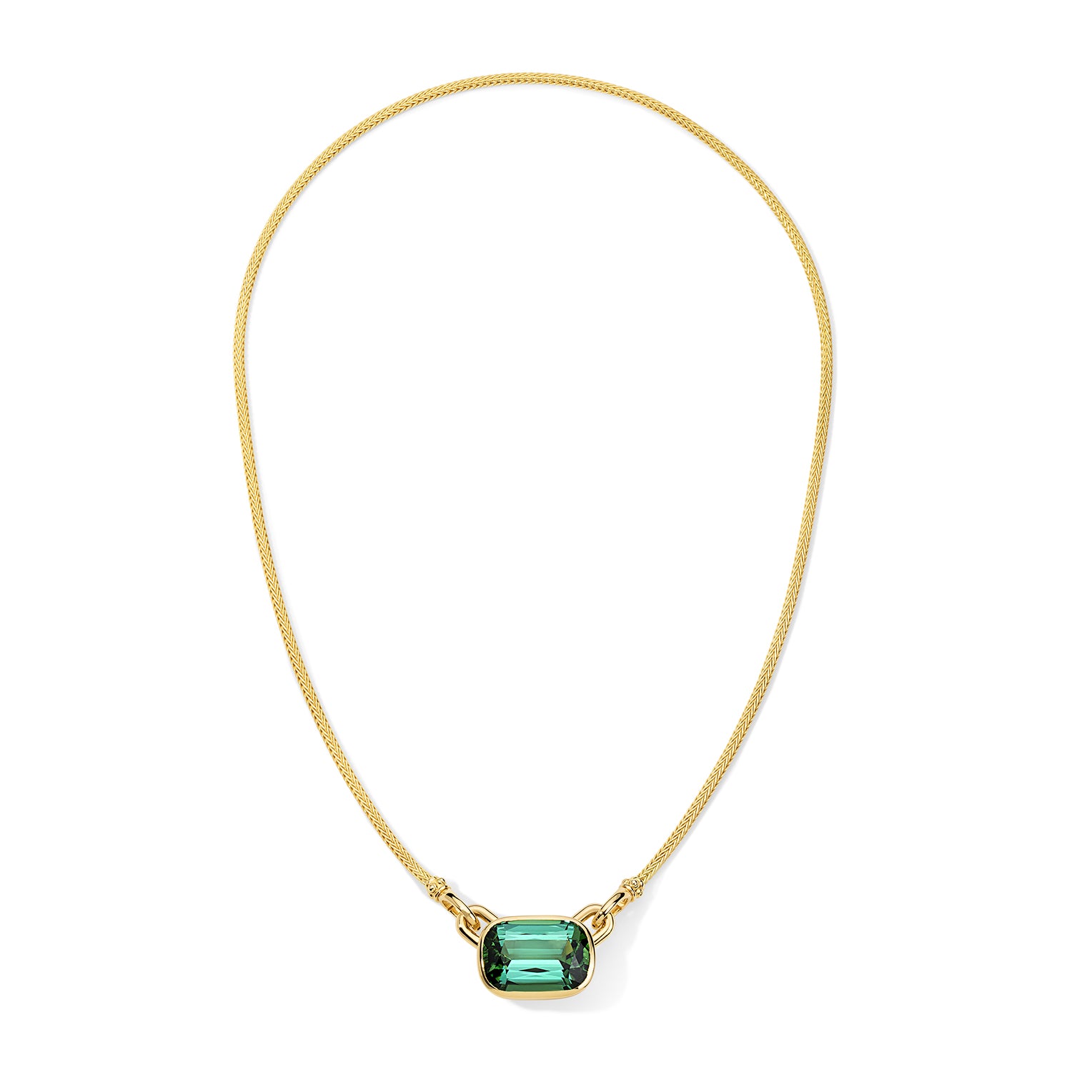 Gold necklace with a green gemstone on a white background